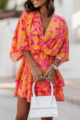 Vestido mini con mangas murciélago, diseño retorcido y estampado de plantas de Heidi
